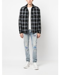 hellblaue enge Jeans mit Destroyed-Effekten von Amiri