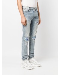 hellblaue enge Jeans mit Destroyed-Effekten von Amiri