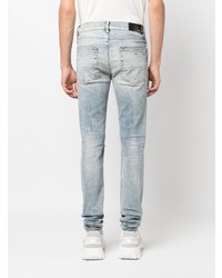 hellblaue enge Jeans mit Destroyed-Effekten von Amiri