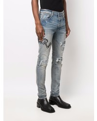 hellblaue enge Jeans mit Destroyed-Effekten von Amiri