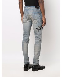 hellblaue enge Jeans mit Destroyed-Effekten von Amiri