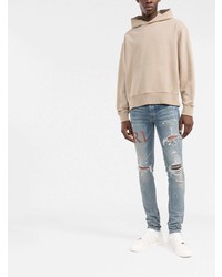 hellblaue enge Jeans mit Destroyed-Effekten von Amiri