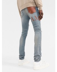 hellblaue enge Jeans mit Destroyed-Effekten von Amiri