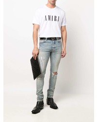 hellblaue enge Jeans mit Destroyed-Effekten von Amiri