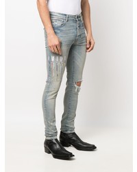 hellblaue enge Jeans mit Destroyed-Effekten von Amiri