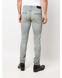 hellblaue enge Jeans mit Destroyed-Effekten von Amiri