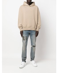 hellblaue enge Jeans mit Destroyed-Effekten von Amiri