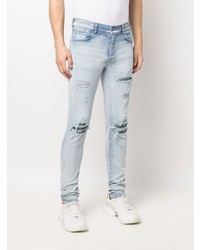 hellblaue enge Jeans mit Destroyed-Effekten von Amiri