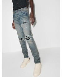 hellblaue enge Jeans mit Destroyed-Effekten von Amiri