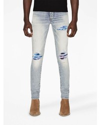 hellblaue enge Jeans mit Destroyed-Effekten von Amiri