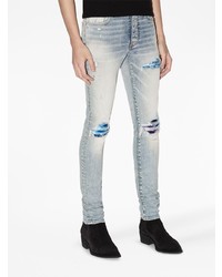 hellblaue enge Jeans mit Destroyed-Effekten von Amiri