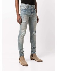 hellblaue enge Jeans mit Destroyed-Effekten von Amiri