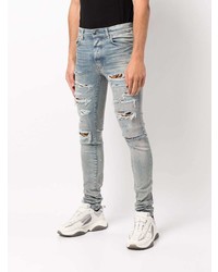 hellblaue enge Jeans mit Destroyed-Effekten von Amiri