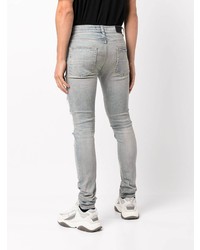 hellblaue enge Jeans mit Destroyed-Effekten von Amiri