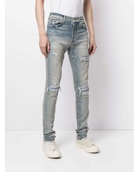 hellblaue enge Jeans mit Destroyed-Effekten von Amiri