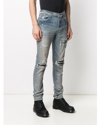 hellblaue enge Jeans mit Destroyed-Effekten von Amiri