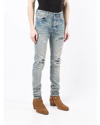 hellblaue enge Jeans mit Destroyed-Effekten von Amiri