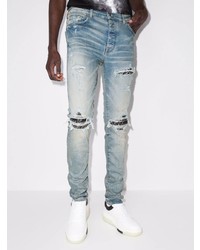 hellblaue enge Jeans mit Destroyed-Effekten von Amiri