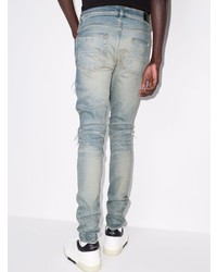 hellblaue enge Jeans mit Destroyed-Effekten von Amiri