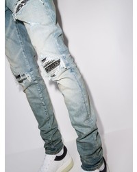 hellblaue enge Jeans mit Destroyed-Effekten von Amiri