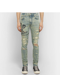 hellblaue enge Jeans mit Destroyed-Effekten von Amiri