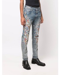 hellblaue enge Jeans mit Destroyed-Effekten von Amiri