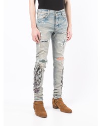 hellblaue enge Jeans mit Destroyed-Effekten von Amiri