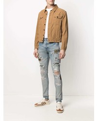 hellblaue enge Jeans mit Destroyed-Effekten von Amiri