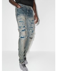 hellblaue enge Jeans mit Destroyed-Effekten von Amiri