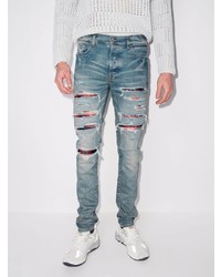 hellblaue enge Jeans mit Destroyed-Effekten von Amiri