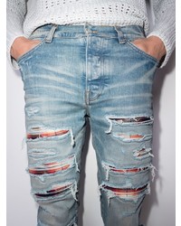 hellblaue enge Jeans mit Destroyed-Effekten von Amiri