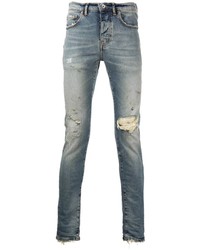 hellblaue enge Jeans mit Destroyed-Effekten von purple brand