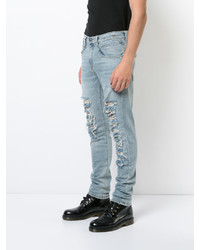 hellblaue enge Jeans mit Destroyed-Effekten von R 13