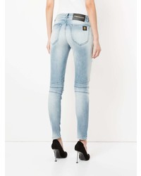 hellblaue enge Jeans mit Destroyed-Effekten von PIERRE BALMAIN