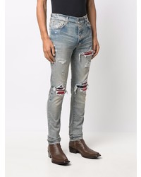 hellblaue enge Jeans mit Destroyed-Effekten von Amiri