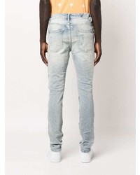 hellblaue enge Jeans mit Destroyed-Effekten von Ksubi