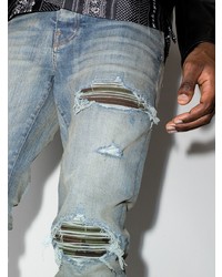 hellblaue enge Jeans mit Destroyed-Effekten von Amiri