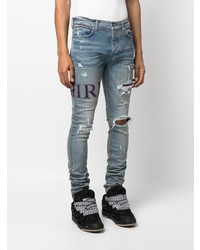 hellblaue enge Jeans mit Destroyed-Effekten von Amiri