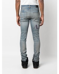 hellblaue enge Jeans mit Destroyed-Effekten von Amiri