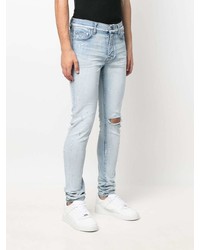 hellblaue enge Jeans mit Destroyed-Effekten von Amiri