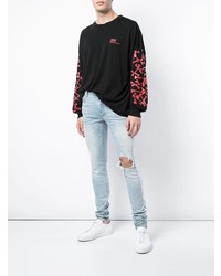 hellblaue enge Jeans mit Destroyed-Effekten von Amiri