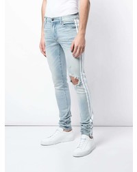 hellblaue enge Jeans mit Destroyed-Effekten von Amiri