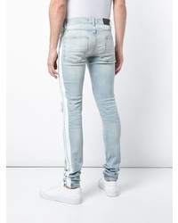 hellblaue enge Jeans mit Destroyed-Effekten von Amiri