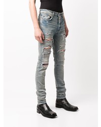 hellblaue enge Jeans mit Destroyed-Effekten von Amiri