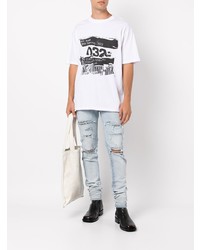 hellblaue enge Jeans mit Destroyed-Effekten von Amiri