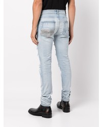 hellblaue enge Jeans mit Destroyed-Effekten von Amiri