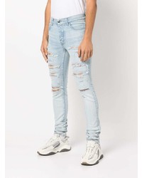 hellblaue enge Jeans mit Destroyed-Effekten von Amiri