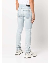 hellblaue enge Jeans mit Destroyed-Effekten von Amiri