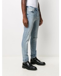 hellblaue enge Jeans mit Destroyed-Effekten von Amiri