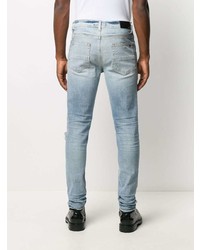 hellblaue enge Jeans mit Destroyed-Effekten von Amiri